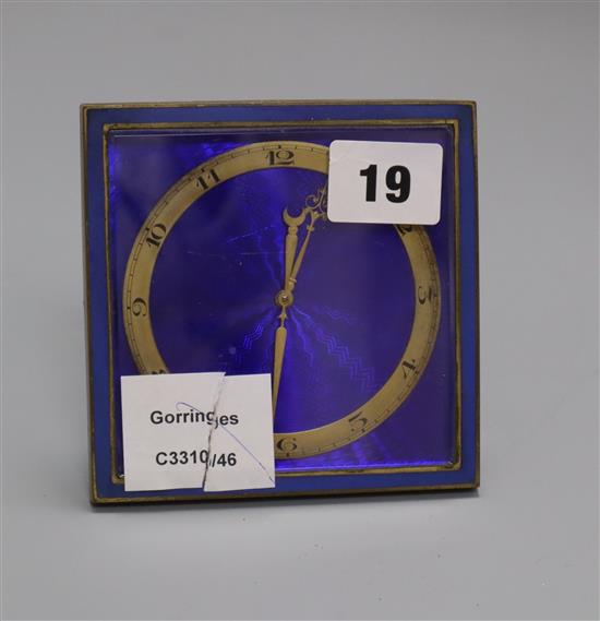 A brass and enamel strut timepiece height 11cm